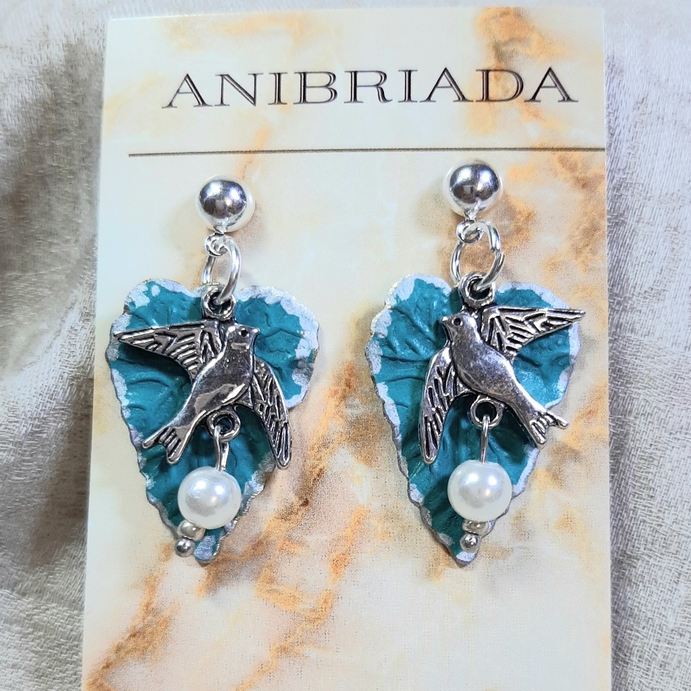 NWT FLOATING BIRD WITH EGG OVER TEAL LEAF EARRINGS